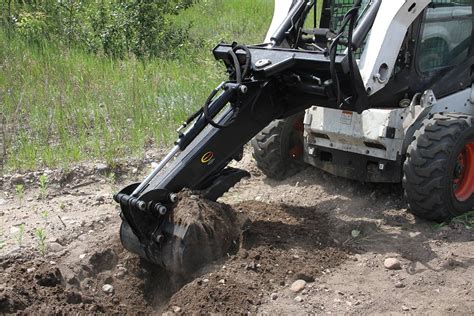 can you dig a hole with a skid steer|digging with a skid steer.